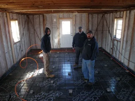 Radiant heating tubing laid over a new floor slab